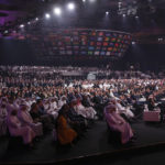 
              FILE - People attend the 2022 soccer World Cup draw at the Doha Exhibition and Convention Center in Doha, Qatar, Friday, April 1, 2022. Many think Qatar is hosting the event to project its influence, build international connections and move past a human-rights record criticized by international groups and workers’ advocates. Critics describe the 2022 World Cup, which starts Sunday, as a classic case of “sportswashing” — using sports to change a country or company's image.  (AP Photo/Hussein Sayed, File)
            
