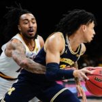 Arizona State's Frankie Collins, left, defends Michigan's Jaelin Llewellyn, right, during the first half of an NCAA college basketball game in the championship round of the Legends Classic Thursday, Nov. 17, 2022, in New York. (AP Photo/Frank Franklin II)