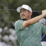 Michael Kim watches his tee shot on the 18th hole during the second round of the Houston Open golf tournament Friday, Nov. 11, 2022, in Houston. (AP Photo/Michael Wyke)