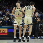 Purdue forward Mason Gillis, left, and guard Ethan Morton celebrate a score against Duke during the first half of an NCAA college basketball game in the Phil Knight Legacy Championship in Portland, Ore., Sunday, Nov. 27, 2022. (AP Photo/Craig Mitchelldyer)