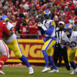 
              Los Angeles Rams quarterback Bryce Perkins, center, looks to pass during the first half of an NFL football game against the Kansas City Chiefs Sunday, Nov. 27, 2022, in Kansas City, Mo. (AP Photo/Ed Zurga)
            