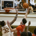 
              Texas Rio Grande Valley forward Dima Zdor (10) goes up to shoot against Texas forward Christian Bishop (32) during the first half of an NCAA college basketball game, Saturday, Nov. 26, 2022, in Austin, Texas. (AP Photo/Michael Thomas)
            