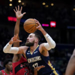 New Orleans Pelicans center Jonas Valanciunas (17) drives to the basket against Toronto Raptors forward Thaddeus Young (21) in the first half of an NBA basketball game in New Orleans, Wednesday, Nov. 30, 2022. (AP Photo/Gerald Herbert)