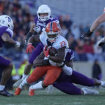 
              Illinois running back Reggie Love III (23) is tackled by Northwestern defensive lineman Adetomiwa Adebawore during the first half of an NCAA college football game in Evanston, Ill., Saturday, Nov. 26, 2022. (AP Photo/Nam Y. Huh)
            