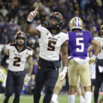 
              Oregon State running back Deshaun Fenwick (5) celebrates after scoring against Washington during the first half of an NCAA college football game Friday, Nov. 4, 2022, in Seattle. (AP Photo/John Froschauer)
            