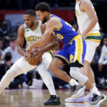 
              Houston Rockets guard Eric Gordon, left, tries to protect the ball as Golden State Warriors guard Stephen Curry, right, attempts a steal during the first half of an NBA basketball game Sunday, Nov. 20, 2022, in Houston. (AP Photo/Michael Wyke)
            