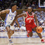 Ohio State's Bruce Thornton (2) handles the ball as Duke's Jeremy Roach (3) defends during the first half of an NCAA college basketball game in Durham, N.C., Wednesday, Nov. 30, 2022. (AP Photo/Ben McKeown)