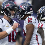 Houston Texans quarterback Davis Mills (10) celebrates with wide receiver Nico Collins (12) after Collins caught a pass for a touchdown against the New York Giants during the third quarter of an NFL football game, Sunday, Nov. 13, 2022, in East Rutherford, N.J. (AP Photo/Seth Wenig)
