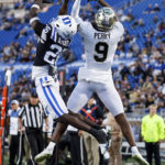 
              A pass intended for Wake Forest's A.T. Perry (9) flies incomplete as Duke's Joshua Pickett defends during the first half of an NCAA college football game in Durham, N.C., Saturday, Nov. 26, 2022. (AP Photo/Ben McKeown)
            