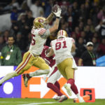 San Francisco 49ers tight end George Kittle scores a touchdown during the second half of an NFL football game against the Arizona Cardinals, Monday, Nov. 21, 2022, in Mexico City. (AP Photo/Marcio Jose Sanchez)