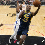 
              Indiana Pacers forward Aaron Nesmith, right, shoots as Los Angeles Clippers center Moses Brown defends during the first half of an NBA basketball game Sunday, Nov. 27, 2022, in Los Angeles. (AP Photo/Mark J. Terrill)
            