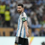 
              Argentina's Lionel Messi walks during the World Cup group C soccer match between Argentina and Mexico, at the Lusail Stadium in Lusail, Qatar, Saturday, Nov. 26, 2022. (AP Photo/Ariel Schalit)
            