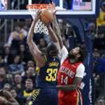 
              Indiana Pacers center Myles Turner (33) takes a shot past New Orleans Pelicans forward Brandon Ingram (14) during the second quarter of an NBA Basketball game, Monday, Nov. 7, 2022, in Indianapolis, Ind. (AP Photo/Marc Lebryk)
            