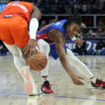 Detroit Pistons guard Jaden Ivey steals the ball from Oklahoma City Thunder guard Shai Gilgeous-Alexander during the second half of an NBA basketball game, Monday, Nov. 7, 2022, in Detroit. (AP Photo/Carlos Osorio)
