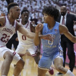 
              CORRECTS CITY TO BLOOMINGTON, INSTEAD OF INDIANAPOLIS - North Carolina guard Seth Trimble (0) drives against Indiana forward Trayce Jackson-Davis (23) during the first half of an NCAA college basketball game in Bloomington, Ind., Wednesday, Nov. 30, 2022. (AP Photo/Darron Cummings)
            