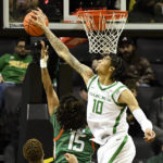 
              Oregon center Kel'el Ware (10) blocks a shot by Florida A&M guard Noah Meren (15) during the first half of an NCAA college basketball game Monday, Nov. 7, 2022, in Eugene, Ore. (AP Photo/Andy Nelson)
            
