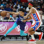 
              Charlotte Hornets guard James Bouknight, left, drives past Brooklyn Nets guard Patty Mills during the first half of an NBA basketball game, Saturday, Nov. 5, 2022, in Charlotte, N.C. (AP Photo/Rusty Jones)
            