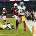 San Francisco 49ers wide receiver Deebo Samuel scores a touchdown during the second half of an NFL football game against the Arizona Cardinals, Monday, Nov. 21, 2022, in Mexico City. (AP Photo/Marcio Jose Sanchez)