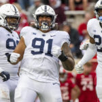 
              Penn State defensive tackle Dvon Ellies (91) reacts after sacking Indiana quarterback Jack Tuttle during the first half of an NCAA college football game, Saturday, Nov. 5, 2022, in Bloomington, Ind. Tuttle was injured on the play. (AP Photo/Doug McSchooler)
            