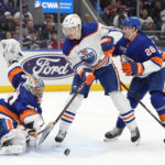 
              New York Islanders goaltender Ilya Sorokin (30) makes a save against Edmonton Oilers left wing Zach Hyman (18) during the first period of an NHL hockey game Wednesday, Nov. 23, 2022, in Elmont, N.Y. (AP Photo/John Minchillo)
            