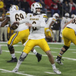 
              Wyoming quarterback Andrew Peasley drops back to pass against Fresno State during the first half of an NCAA college football game in Fresno, Calif., Friday, Nov. 25, 2022. (AP Photo/Gary Kazanjian)
            