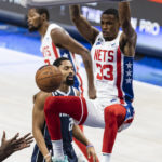 
              Brooklyn Nets forward Nic Claxton (33) dunks during the first half of an NBA basketball game against the Dallas Mavericks, Monday, Nov. 7, 2022, in Dallas. (AP Photo/Brandon Wade)
            