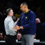 Michigan head coach Juwan Howard, right, shakes hands with Arizona State head coach an NCAA college basketball game in the championship round of the Legends Classic Thursday, Nov. 17, 2022, in New York. Arizona State won 87-62. (AP Photo/Frank Franklin II)