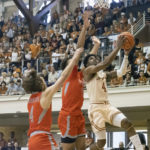
              Texas guard Tyrese Hunter (4) goes up to shoot against Texas Rio Grande Valley guard Will Johnston (4) and forward Ahren Freeman (11) during the first half of an NCAA college basketball game Saturday, Nov. 26, 2022, in Austin, Texas. (AP Photo/Michael Thomas)
            