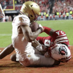 Boston College wide receiver Joseph Griffin Jr., left, hauls in a pass for a touchdown against North Carolina State cornerback Derrek Pitts Jr. (24) in the final moments of the second half of an NCAA college football game Saturday, Nov. 12, 2022, in Raleigh, N.C. (AP Photo/Chris Seward)