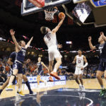 
              Virginia's Ben Vander Plas (5) makes a basket against Monmouth during the first half of an NCAA college basketball game in Charlottesville, Va., Friday, Nov. 11, 2022. (AP Photo/Mike Kropf)
            