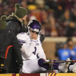 Northwestern quarterback Ryan Hilinski (3) is carted off the field after sustaining an injury during the second half of an NCAA college football game against Minnesota Saturday, Nov. 12, 2022, in Minneapolis. (AP Photo/Abbie Parr)