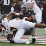 Washington State defensive back Armani Marsh (8) tackles Arizona State wide receiver Cam Johnson (7) during the second half of an NCAA college football game, Saturday, Nov. 12, 2022, in Pullman, Wash. Washington State won 28-18. (AP Photo/Young Kwak)