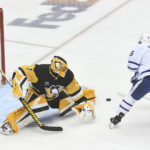 
              Right wing Mitchell Marner scores on Pittsburgh Penguins goalie Casey DeSmith during the first period of an NHL hockey game, Saturday, Nov. 26, 2022, in Pittsburgh. (AP Photo/Philip G. Pavely)
            
