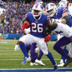 
              Buffalo Bills running back Devin Singletary (26) runs into the end zone for a touchdown as Minnesota Vikings safety Camryn Bynum, center right, tries to defend in the first half of an NFL football game against the Minnesota Vikings, Sunday, Nov. 13, 2022, in Orchard Park, N.Y. (AP Photo/Jeffrey T. Barnes)
            