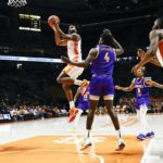 
              Tennessee guard Josiah-Jordan James (30) shoots past Tennessee Tech center Nolan Causwell (4) during the first half of an NCAA college basketball game Monday, Nov. 7, 2022, in Knoxville, Tenn. (AP Photo/Wade Payne)
            