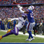 Buffalo Bills wide receiver Gabe Davis (13) catches a touchdown pass as Minnesota Vikings cornerback Akayleb Evans (21) tries to defend in the first half of an NFL football game, Sunday, Nov. 13, 2022, in Orchard Park, N.Y. (AP Photo/Jeffrey T. Barnes)