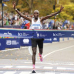 
              Evans Chebet, of Kenya, crosses the finish line first in the men's division of the New York City Marathon, Sunday, Nov. 6, 2022, in New York. (AP Photo/Jason DeCrow)
            