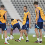 England forward Harry Kane, middle, takes part in drills during England's official training on the eve of the group B World Cup soccer match between England and Iran, at Al Wakrah Sports Complex, in Al Wakrah, Qatar, Sunday, Nov. 20, 2022. (AP Photo/Abbie Parr)