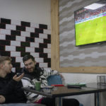 
              Hlib Kuian, left, and Roman Kryvyi watch a World Cup soccer match on a screen at Mazza Cafe kebab-stand, in Irpin, Kyiv region, Ukraine, Tuesday, Nov. 29, 2022. For soccer lovers in Ukraine, Russia's invasion and the devastation it has wrought have created uncertainties about both playing the sport and watching it. For Ukrainians these days, soccer trails well behind mere survival in the order of priorities. (AP Photo/Andrew Kravchenko)
            