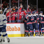 Members of the Washington Capitals celebrate Aliaksei Protas' goal in the second period of an NHL hockey game against the Tampa Bay Lightning, Friday, Nov. 11, 2022, in Washington. (AP Photo/Patrick Semansky)