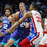 
              Charlotte Hornets center Mason Plumlee (24) drives in to the lane against Brooklyn Nets forward Nic Claxton (33) during the first half of an NBA basketball game, Saturday, Nov. 5, 2022, in Charlotte, N.C. (AP Photo/Rusty Jones)
            