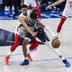 
              Dallas Mavericks center Christian Wood (35) battles Brooklyn Nets guard Ben Simmons (10) for space during the first half of an NBA basketball game, Monday, Nov. 7, 2022, in Dallas. (AP Photo/Brandon Wade)
            