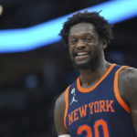 
              New York Knicks forward Julius Randle smiles during the first half of an NBA basketball game against the Minnesota Timberwolves, Monday, Nov. 7, 2022, in Minneapolis. (AP Photo/Abbie Parr)
            