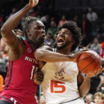 
              Miami's forward Norchad Omier (15) drives to the basket as Rutgers' center Clifford Omoruyi (11) defends during the first half of an NCAA college basketball game, Wednesday, Nov. 30, 2022, in Coral Gables, Fla. (AP Photo/Marta Lavandier)
            