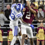 
              Boston College's Joseph Griffin (2) hauls in a pass just short of the end zone as Duke cornerback Tony Davis (13) attempts to break it up during the second half of an NCAA college football game Friday, Nov. 4, 2022, in Boston. (AP Photo/Mark Stockwell)
            