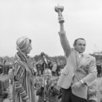 
              FILE - Dow Finsterwald, the non-playing captain of the American Ryder Cup Team, holds up the cup after presentation on the 18th green by Princess Alexandra at the Royal Lytham and St. Anne's Golf Course in Lytham St Annes, England, on Sept. 17, 1977.  Finsterwald, a 12-time winner on the PGA Tour, died Friday night, Nov. 4, 2022, at his home in Colorado Springs, Colo. He was 93. His son, Dow Finsterwald Jr., said he died peacefully in his sleep. (AP Photo/File)
            