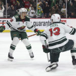 
              Minnesota Wild center Sam Steel (13) celebrates with defenseman Jared Spurgeon (46) after Steel scored a goal against the Carolina Hurricanes during the third period of an NHL hockey game Saturday, Nov. 19, 2022, in St. Paul, Minn. Minnesota won 2-1 in overtime. (AP Photo/Stacy Bengs)
            