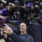 
              Baltimore Ravens head coach John Harbaugh takes a selfie with fans after an NFL football game against the New Orleans Saints in New Orleans, Monday, Nov. 7, 2022. The Ravens won 27-13. (AP Photo/Butch Dill)
            