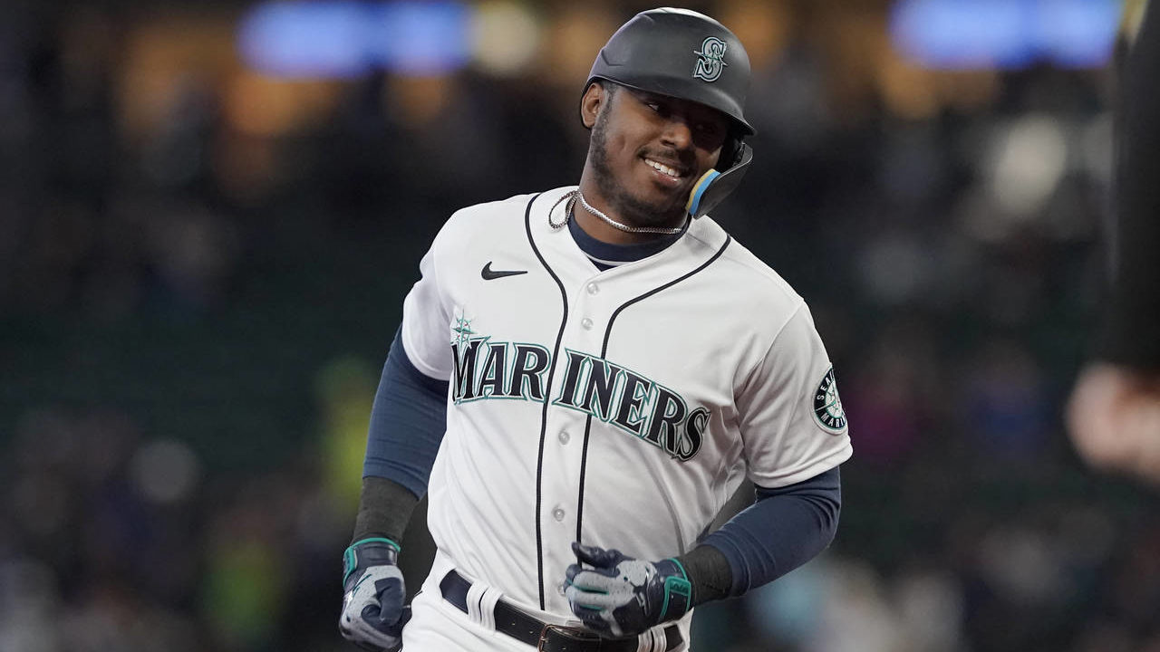 FILE - Seattle Mariners' Kyle Lewis runs the bases after he hit a solo home run against the Houston...