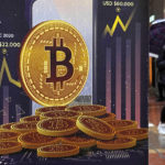 
              FILE - An advertisement for Bitcoin cryptocurrency is displayed on a street in Hong Kong, on Feb. 17, 2022.  Bitcoin slumped to a two-year low, Wednesday, Nov. 9, and other digital assets sold off following the sudden collapse of crypto exchange FTX Trading, which has been forced to sell itself to larger rival Binance. (AP Photo/Kin Cheung, File)
            
